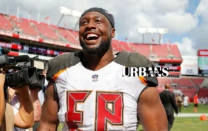 Gerald McCoy with a football, exploring his net worth and NFL career highlights.