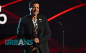 Chayanne performing on stage, showcasing his career achievements and discussing his net worth.