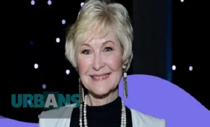 Alt Text: "dee wallace net worth - The beloved E.T. actress Dee Wallace photographed at a Hollywood event in 2024, radiating success with her signature warm smile. Her polished appearance and confident demeanor reflect her journey from horror film icon to multi-millionaire entrepreneur with a current net worth of $4 million.