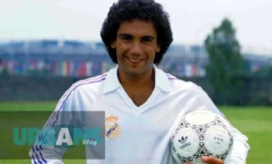 Hugo Sanchez soccer star performing his signature backflip celebration in Real Madrid's white jersey at Santiago Bernabéu Stadium